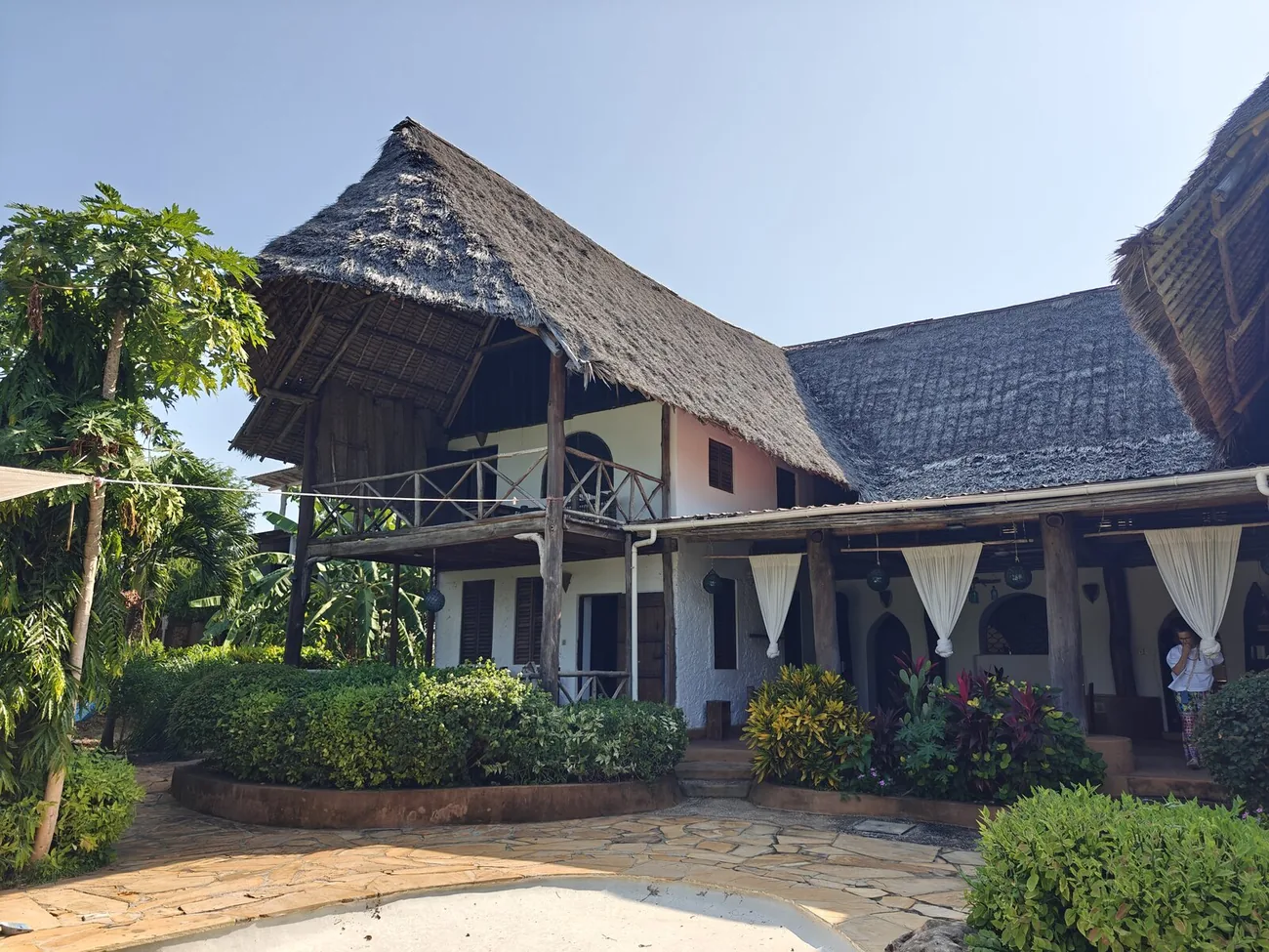 The main villa at Cheche Vule beneath its makuti roof.